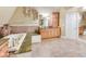 Luxurious bathroom with a large soaking tub, granite counters, and ample storage at 460 Dixie Rd, Covington, GA 30014