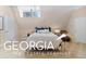 Bright bedroom with a queen-size bed and ample closet space at 460 Dixie Rd, Covington, GA 30014