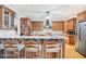 Kitchen boasts wood cabinets, granite countertops and island at 460 Dixie Rd, Covington, GA 30014