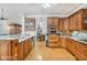 Kitchen with double sinks, wood cabinets and granite counters at 460 Dixie Rd, Covington, GA 30014