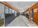 Long row of horse stalls in a well-maintained barn at 460 Dixie Rd, Covington, GA 30014