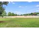Large riding arena with white fencing and covered seating at 460 Dixie Rd, Covington, GA 30014