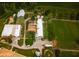 Aerial view of expansive property with multiple buildings and equestrian facilities at 460 Dixie Rd, Covington, GA 30014