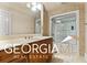 Clean bathroom with a shower/tub combo and vanity at 460 Dixie Rd, Covington, GA 30014