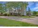 Unique two-story house with a tower and landscaped yard at 460 Dixie Rd, Covington, GA 30014