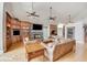 Open living room featuring hardwood floors and a stone fireplace at 460 Dixie Rd, Covington, GA 30014