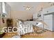 Kitchen with white cabinets and a dining area at 460 Dixie Rd, Covington, GA 30014