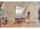 Formal dining room with wood floors and a round table at 460 Dixie Rd, Covington, GA 30014