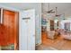 Inviting entryway with view of the living room, hardwood floors and a charming staircase at 460 Dixie Rd, Covington, GA 30014