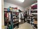 Large walk-in closet with shelving and hanging rods at 2700 Arden Sw Ter, Conyers, GA 30094