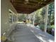 Covered patio with concrete flooring, overlooks wooded area at 2700 Arden Sw Ter, Conyers, GA 30094