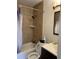 Bathroom with tub, shower, and dark vanity at 3806 London Dr, Decatur, GA 30032