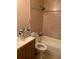 Bathroom with shower/tub combo and tiled walls at 3806 London Dr, Decatur, GA 30032
