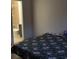 Bedroom with floral bedding and an ensuite bathroom at 3806 London Dr, Decatur, GA 30032