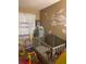 Bedroom featuring crib, toys, and space-themed decor at 3806 London Dr, Decatur, GA 30032