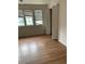 Spacious bedroom with wood-look flooring and an adjacent bathroom at 3806 London Dr, Decatur, GA 30032