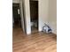 Bedroom with bathroom access and wood-look floors at 3806 London Dr, Decatur, GA 30032