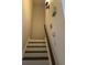 Simple white staircase with dark brown railings at 3806 London Dr, Decatur, GA 30032