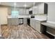 Modern kitchen with gray cabinets and quartz countertops at 8 S Ola Rd., Mcdonough, GA 30252