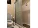 Bathroom featuring a shower with sliding glass doors and hexagonal tiled walls at 3000 Parc Lorraine, Lithonia, GA 30038