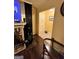 Living room with dark wood floors, fireplace, and entryway at 3000 Parc Lorraine, Lithonia, GA 30038