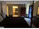 Large bedroom with a four-poster bed, dresser, and ensuite bathroom at 3000 Parc Lorraine, Lithonia, GA 30038
