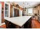 Large kitchen with island, stainless steel appliances, and exposed brick at 2204 Monticello St, Covington, GA 30014