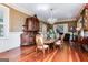 Formal dining room with hardwood floors, antique furniture, and a crystal chandelier at 2204 Monticello St, Covington, GA 30014