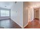 Home hallway with wood flooring and neutral walls at 6273 Amberly Rd, Rex, GA 30273