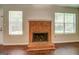 Brick fireplace with glass doors in living room at 6273 Amberly Rd, Rex, GA 30273