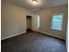 Simple bedroom with carpet, window and a closet at 3541 Gleneagles Ct, Snellville, GA 30039