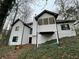 Two-story house with white exterior and deck at 3541 Gleneagles Ct, Snellville, GA 30039