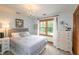 Spacious bedroom with double bed, dresser, and large windows at 2398 Maddox Rd, Buford, GA 30519