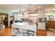 Modern kitchen with white cabinets, marble island, and high-end appliances at 2398 Maddox Rd, Buford, GA 30519