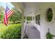Spacious front porch with rocking chairs and American flag at 2398 Maddox Rd, Buford, GA 30519