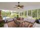 Screened porch overlooking the pool and backyard at 2398 Maddox Rd, Buford, GA 30519