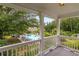 Porch view of backyard pool and lush landscaping at 2398 Maddox Rd, Buford, GA 30519