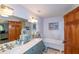 Elegant bathroom with double vanity, clawfoot tub, and marble countertops at 2398 Maddox Rd, Buford, GA 30519