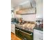Stainless steel range and oven with a large custom vent hood at 2398 Maddox Rd, Buford, GA 30519