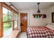 Cozy bedroom with wood floors, large windows and a comfortable bed at 2398 Maddox Rd, Buford, GA 30519