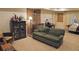 Finished basement with a couch, workspace, and storage at 2398 Maddox Rd, Buford, GA 30519