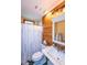 Clean bathroom with shower/tub combo and wood-paneled walls at 2398 Maddox Rd, Buford, GA 30519