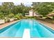 Inviting rectangular pool with diving board and patio furniture at 2398 Maddox Rd, Buford, GA 30519
