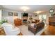 Spacious living room with a fireplace and hardwood floors at 2398 Maddox Rd, Buford, GA 30519