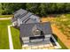 Aerial view showcasing a home's exterior, highlighting its modern design and landscaping at 604 N Van Wert N Rd, Villa Rica, GA 30180