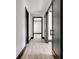 Bright hallway with dark-trimmed doors and light wood flooring at 604 N Van Wert N Rd, Villa Rica, GA 30180