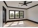 Spacious bedroom featuring wood floors and three large windows at 604 N Van Wert N Rd, Villa Rica, GA 30180