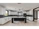 Modern kitchen with white cabinets, large island, and herringbone backsplash at 604 N Van Wert N Rd, Villa Rica, GA 30180