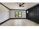Spacious bedroom with dark-accent wall and hardwood floors at 604 N Van Wert N Rd, Villa Rica, GA 30180