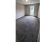 Bright bedroom with carpet and large window at 6050 April Dr, Sugar Hill, GA 30518
